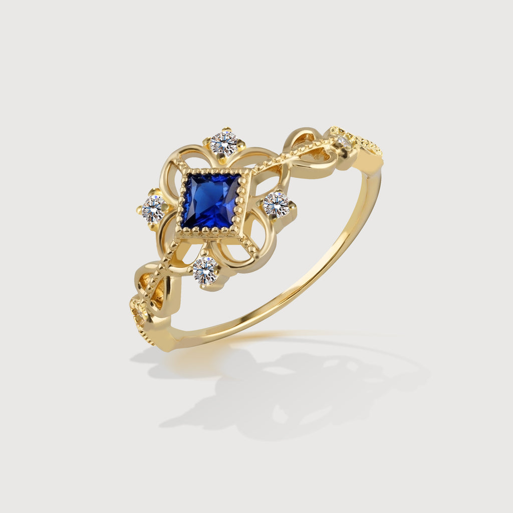 Anillo de oro con circonita azul